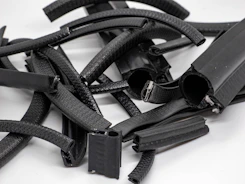 Precision molded rubber components arranged on a clean surface.
