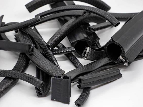 Close-up of various seals and o-rings neatly arranged on a workshop table.