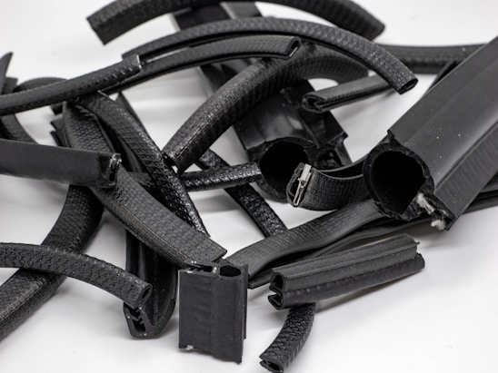 Close-up of durable rubber profiles arranged neatly on a workshop table.