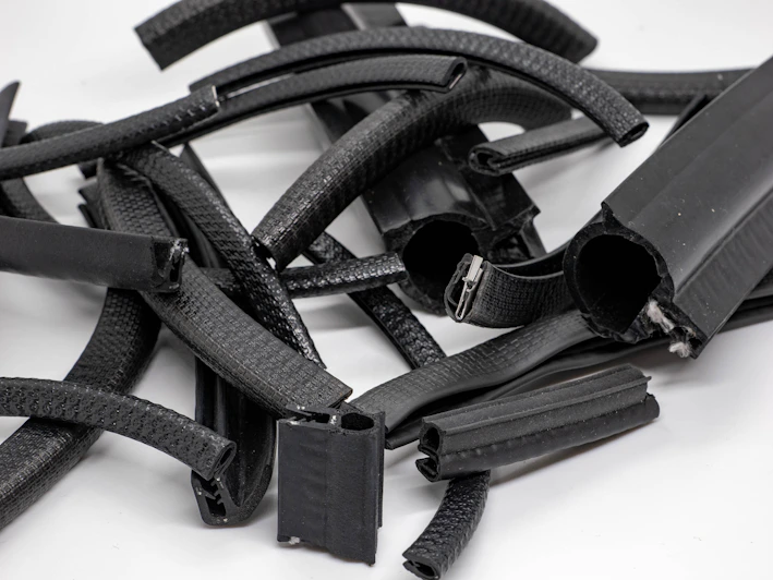 Close-up of various rubber seals neatly arranged on a wooden table