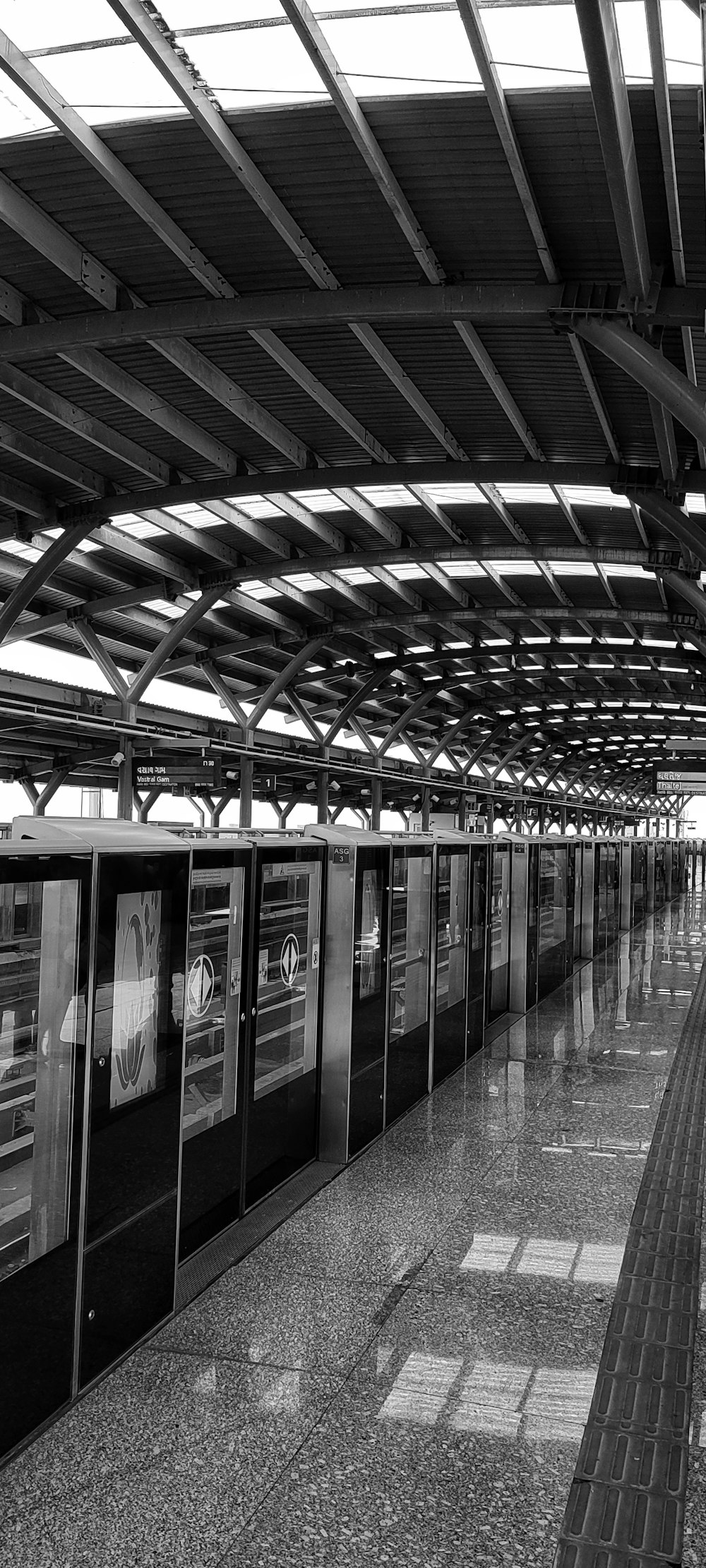 a black and white photo of a train station