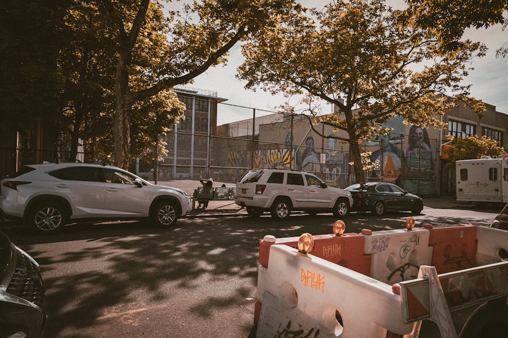 a couple of cars that are parked in the street