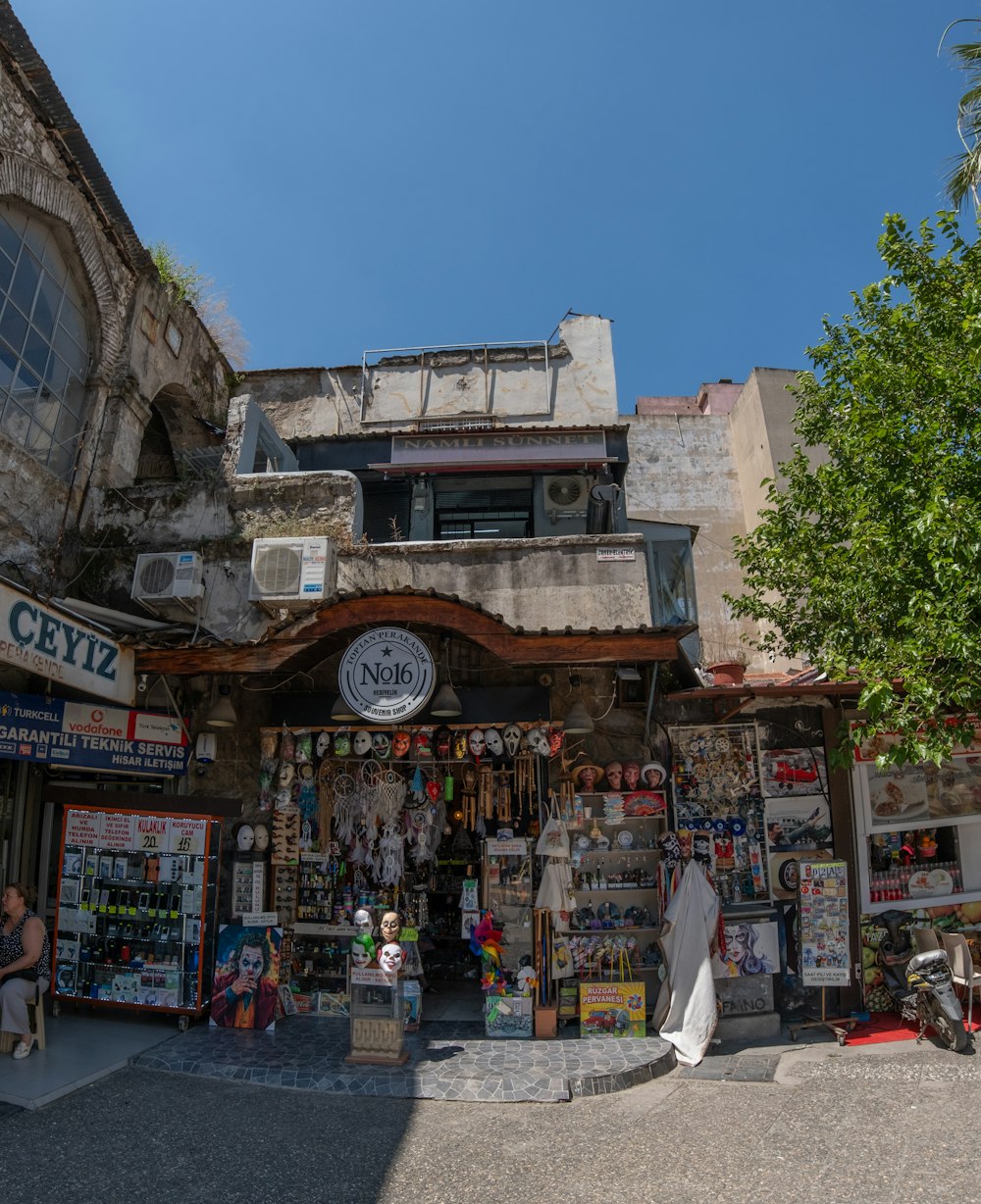 a building with a lot of shops on the outside of it