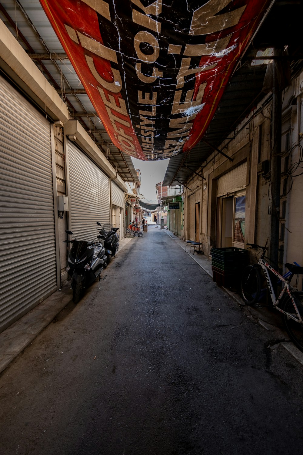 a street with a motorcycle parked on the side of it