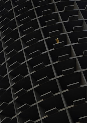 a yellow object is in the middle of a black structure