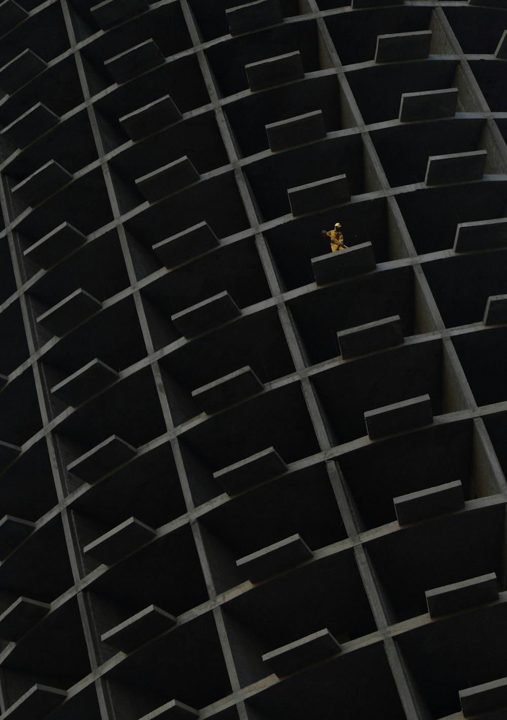 a yellow object is in the middle of a black structure