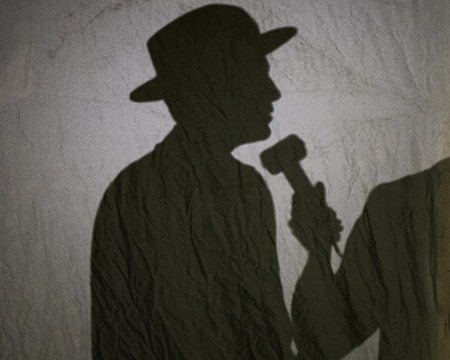 A collage of handwritten court papers, a microphone, and a shadowy figure with a baseball cap.