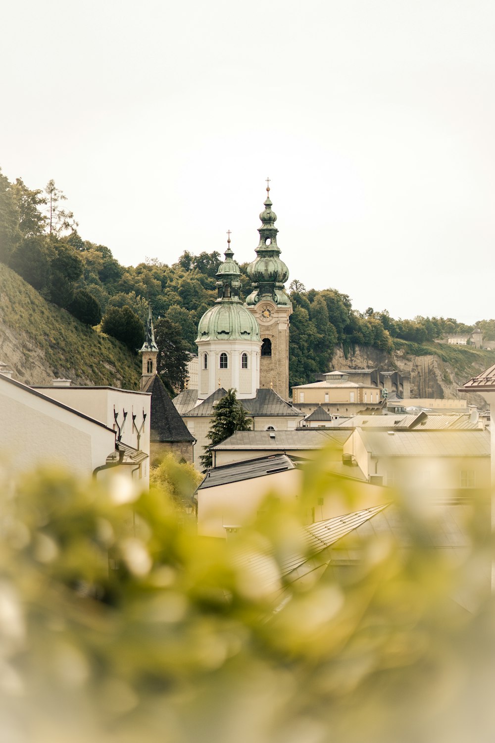 a view of a building with a steeple in the background