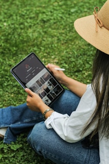 A tech-savvy individual using a tablet outdoors.