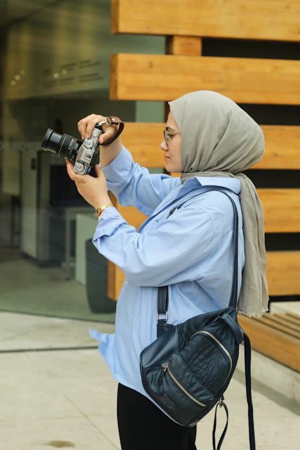 A woman taking a picture with a camera