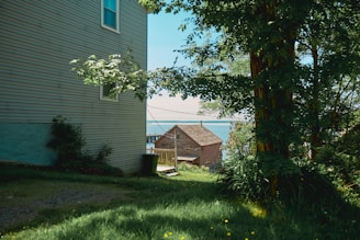 a house sitting next to a body of water