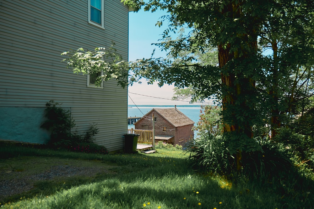 a house sitting next to a body of water