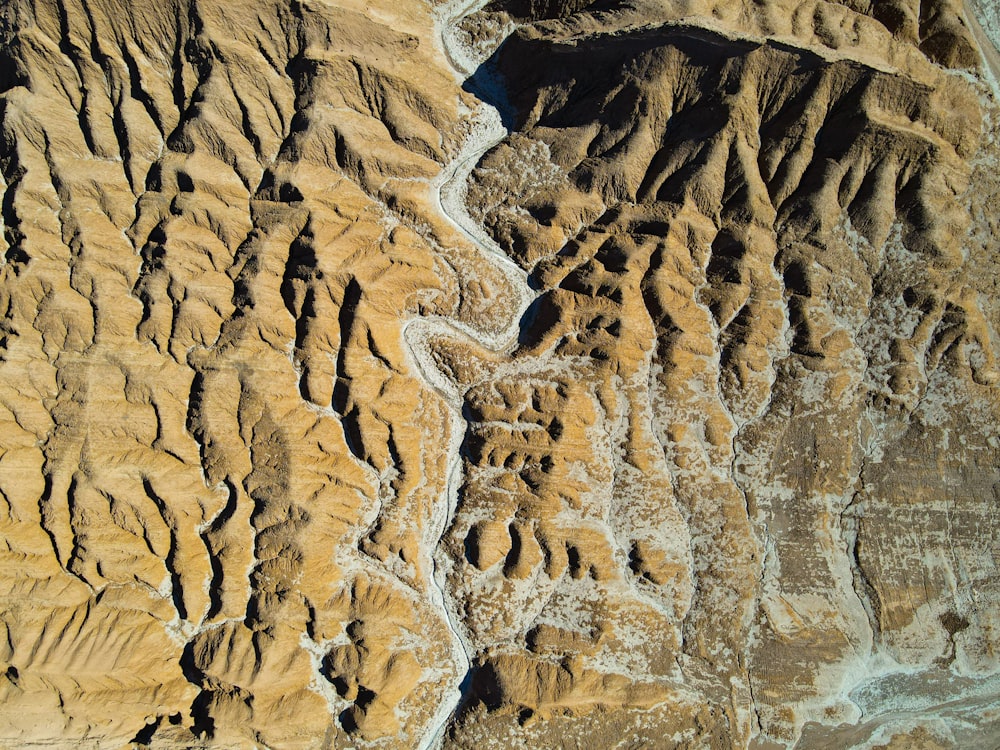 an aerial view of a river running through a desert