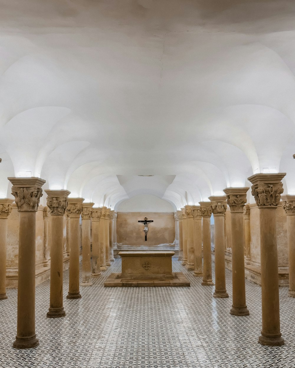 a church with a cross on the alter