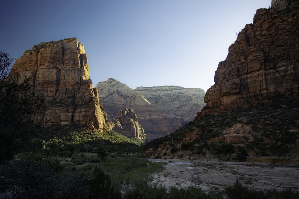 a view of a canyon with mountains in the background