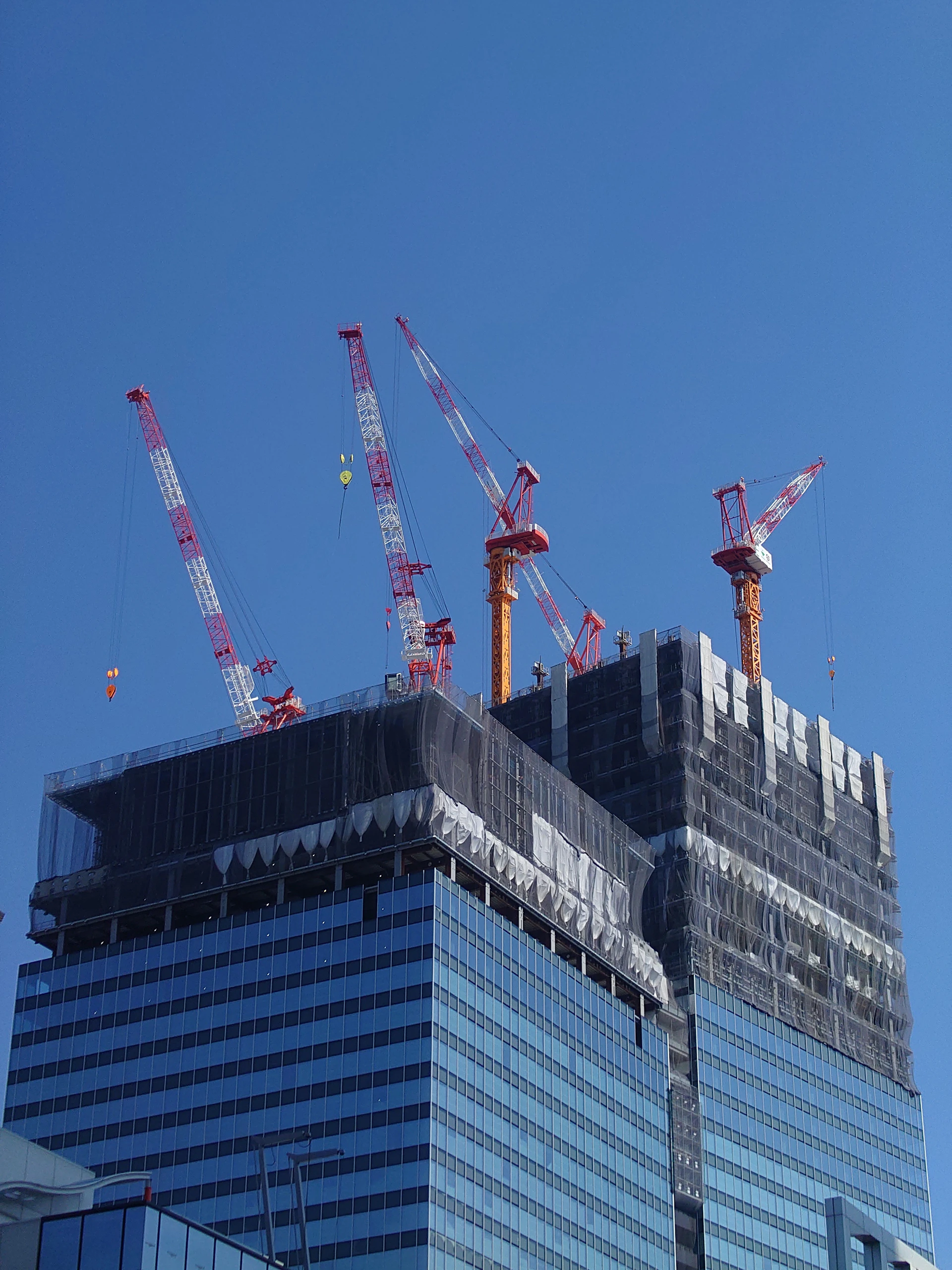 woman wearing yellow long-sleeved dress under white clouds and blue sky during daytime