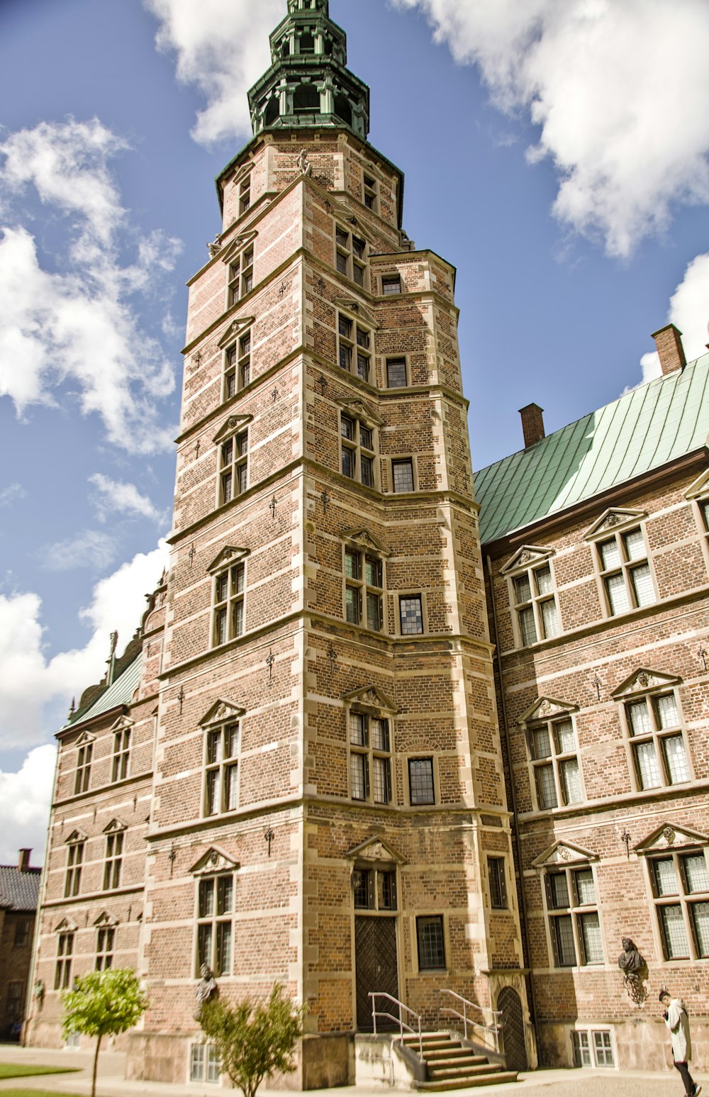 a tall tower with a clock on the top of it