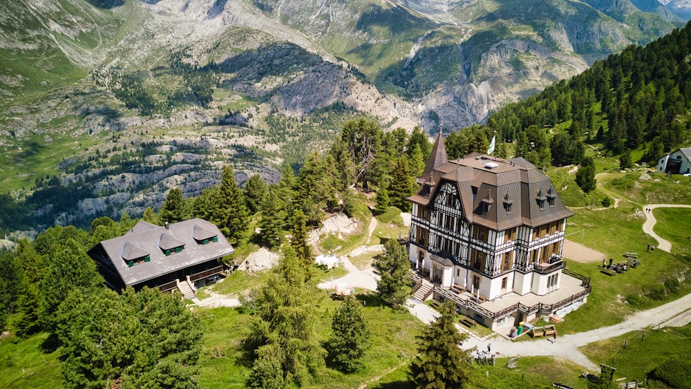 an aerial view of a house in the mountains