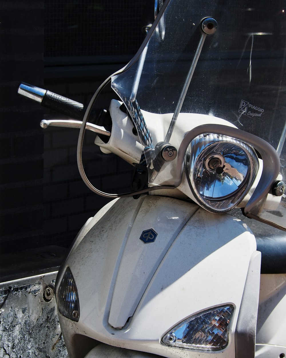 a close up of a motorcycle with a mirror on it