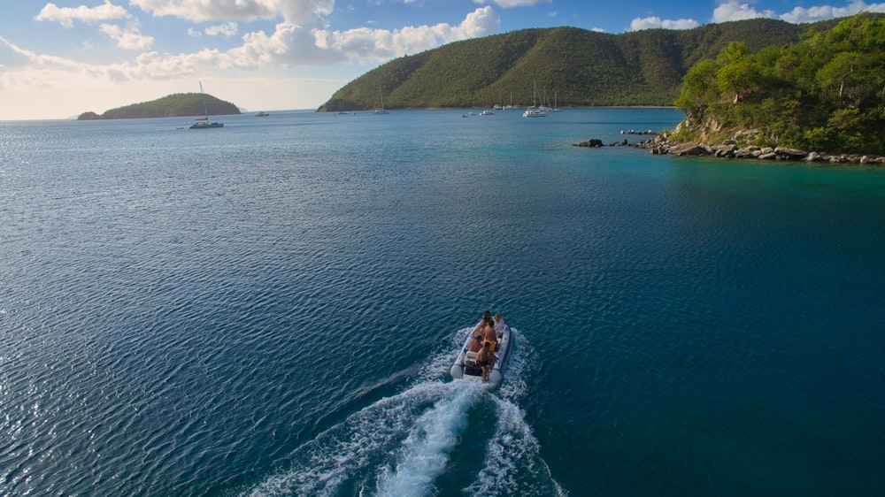 a boat traveling on a body of water