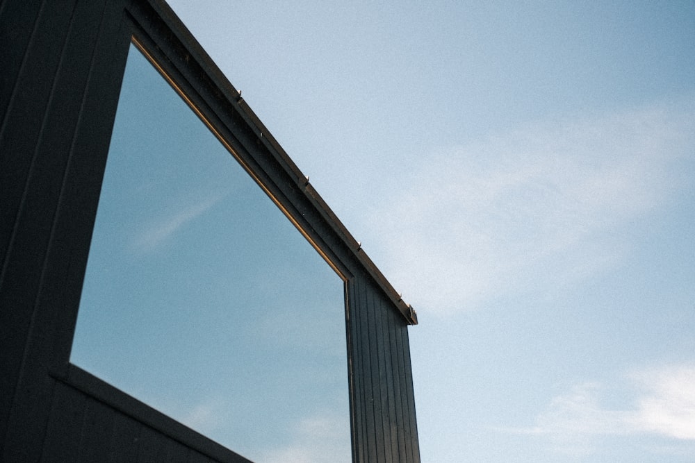 a reflection of a building in a window