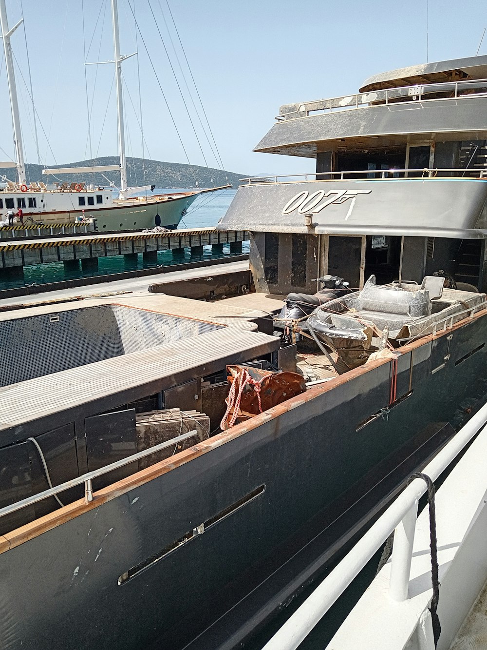 a large boat is docked at a dock