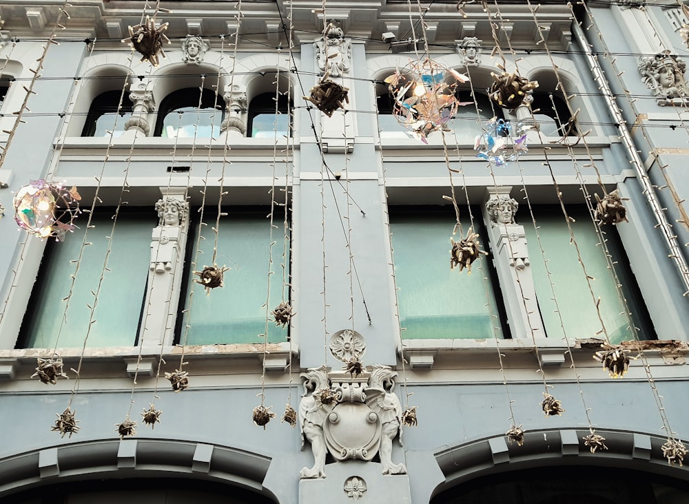 a large building with a bunch of decorations hanging from it's windows