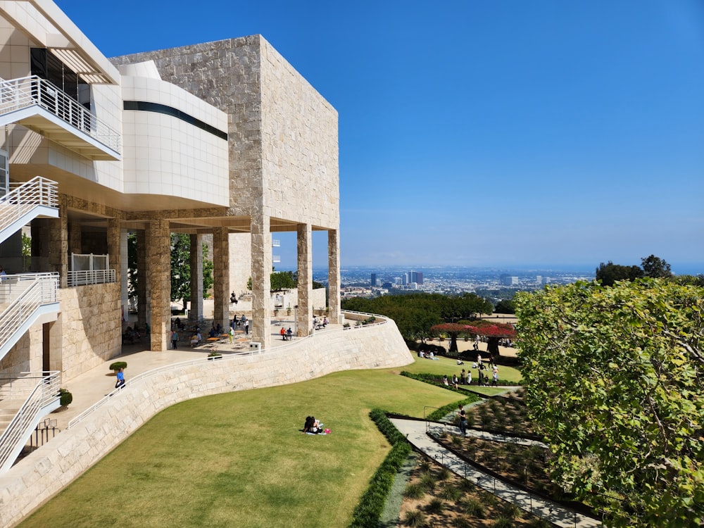 a view of a building from the top of a hill