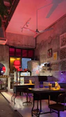 Warmly lit cafe interior with jharkhandi-inspired wall art and wooden furniture.