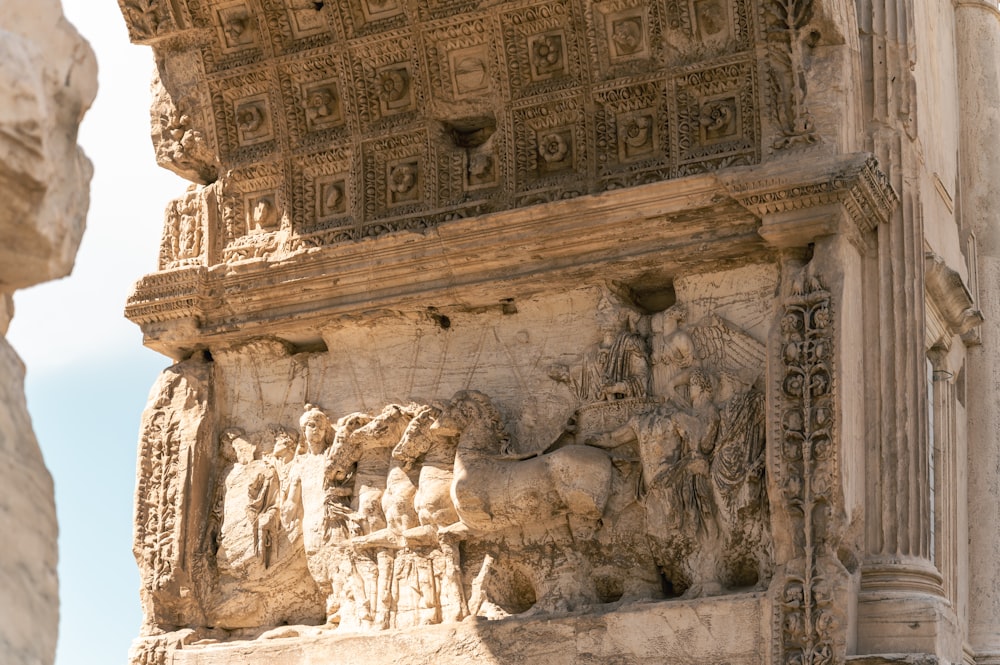 a close up of a building with carvings on it