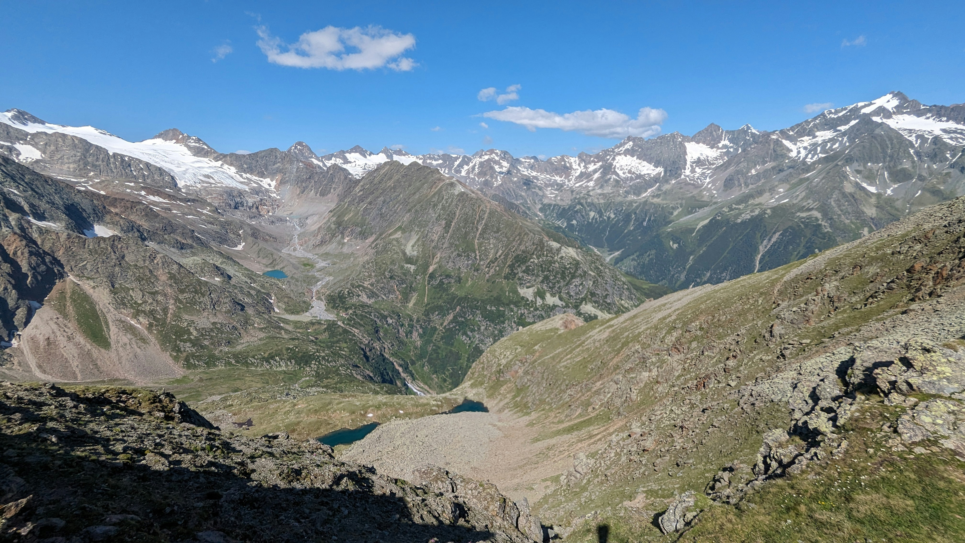 A view of a mountain range with a lake in the middle