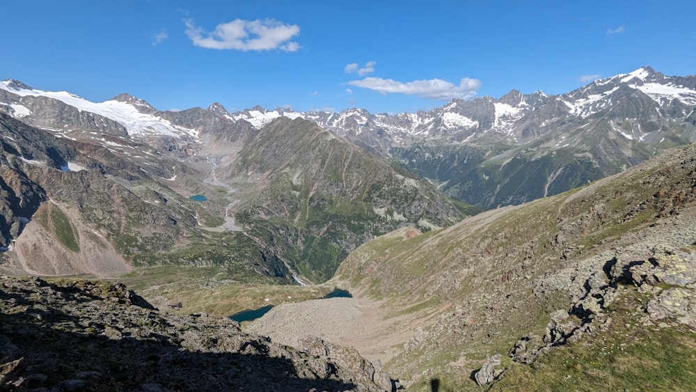 a view of a mountain range with a lake in the middle