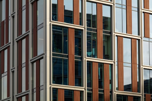 Commercial building facade featuring large aluminum framed windows.