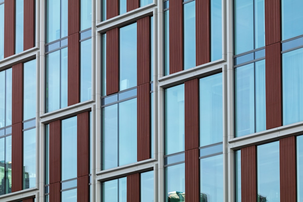 a tall building with lots of windows next to a clock