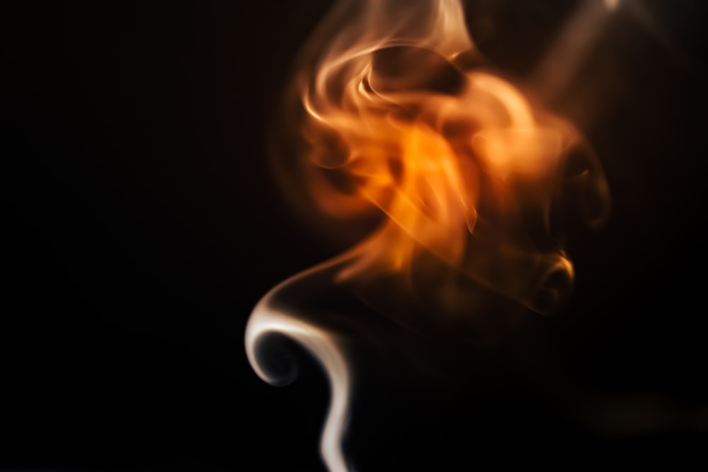 a blurry photo of smoke on a black background