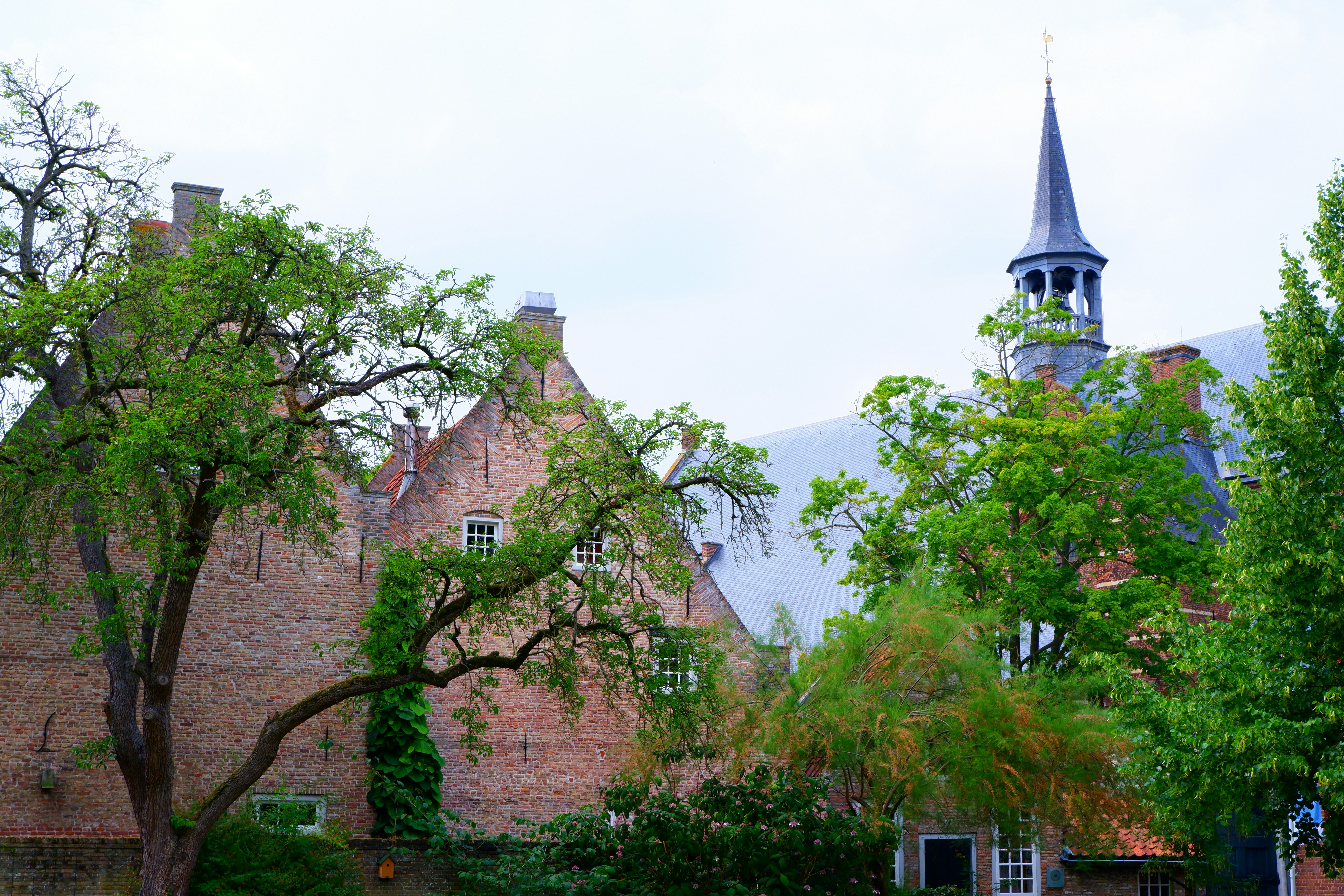 a large brick building with a steeple on top of it