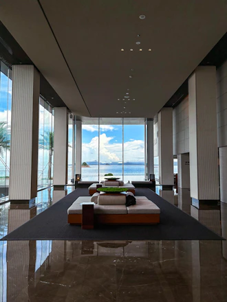 A vibrant hotel lobby in the South Pacific showcasing modern furniture and equipment sourced from Yantai.