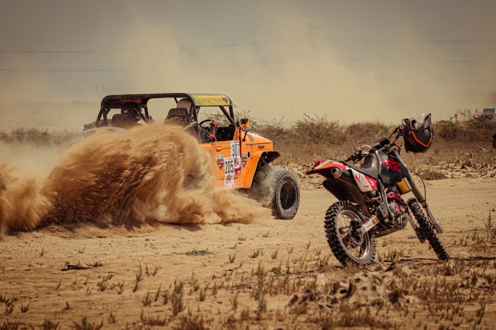 a dirt bike is kicking up dust in the desert