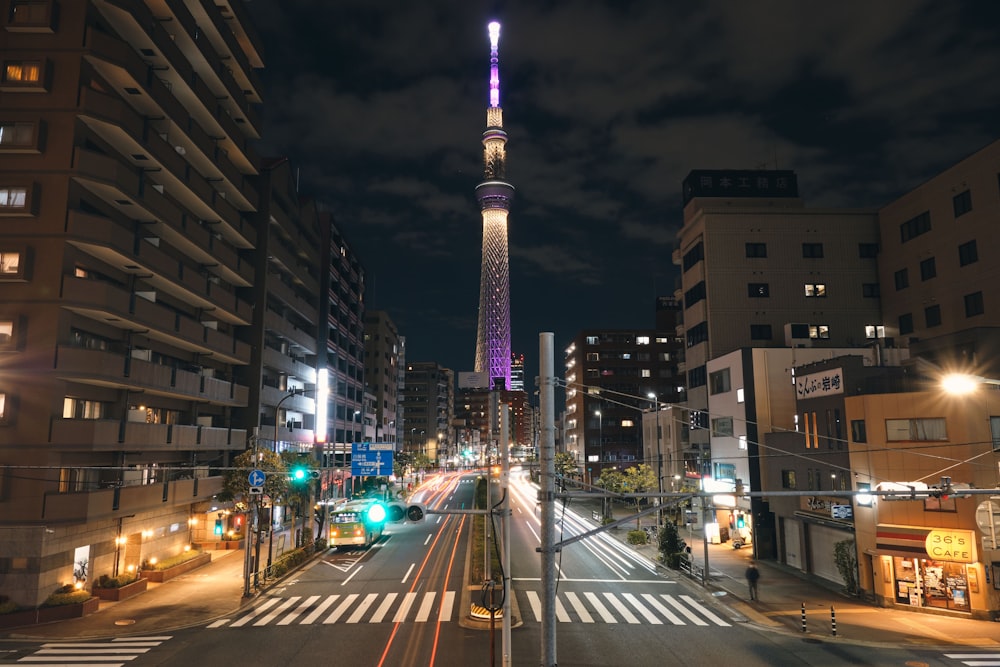 a very tall tower towering over a city at night