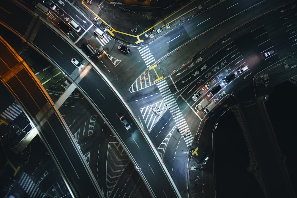 an aerial view of an intersection at night