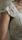 Close-up of a woman wearing the cow embroidered dress, highlighting delicate embroidery and soft fabric.