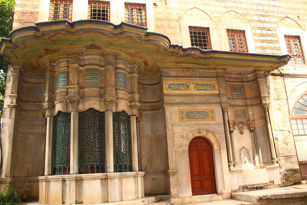 a large building with a red door and windows