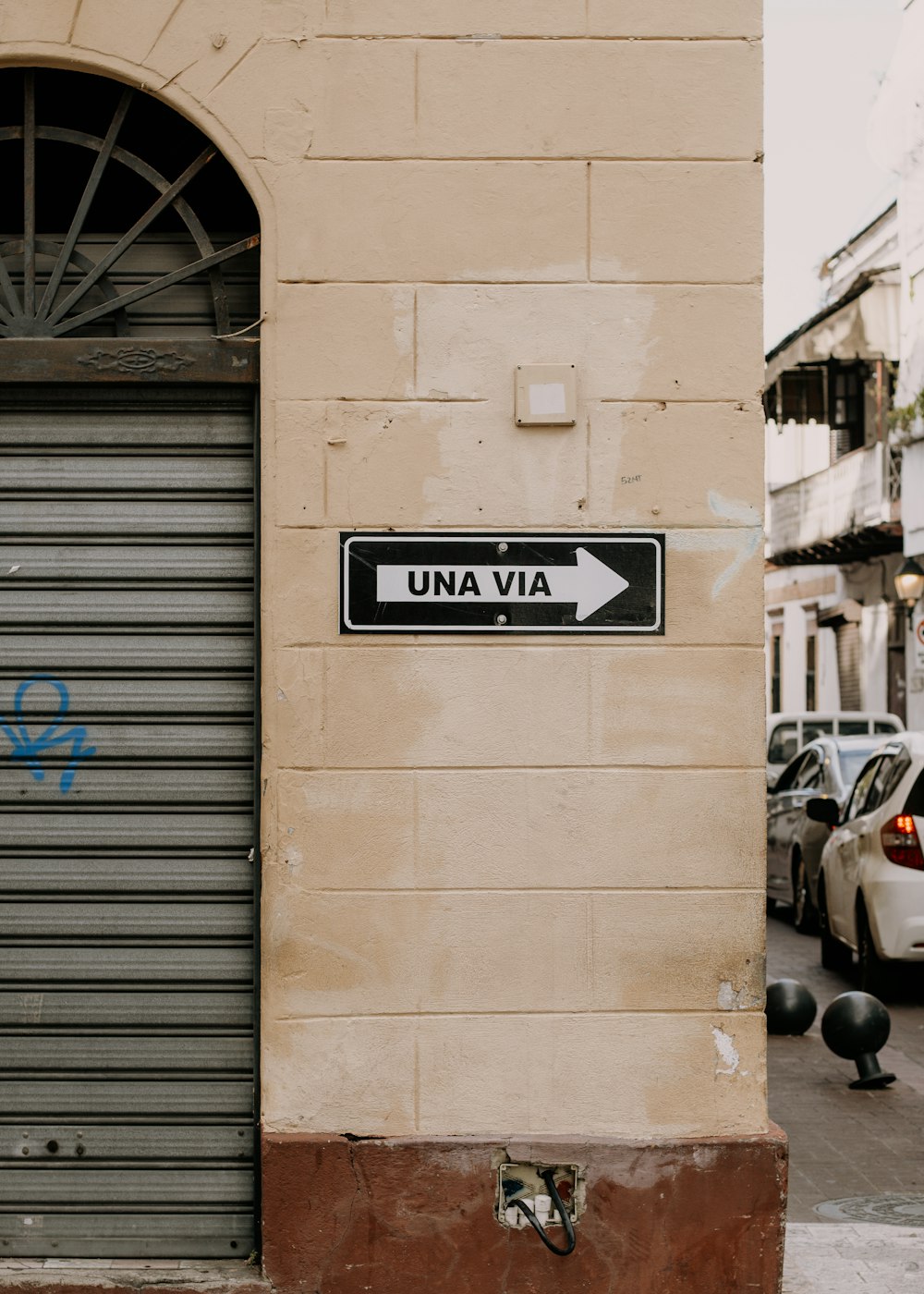 a street sign on a building in a foreign country