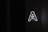 A large, glowing letter 'A' with a stylized arrow pointing upwards inside it is placed against a dark background, emitting bright white light.