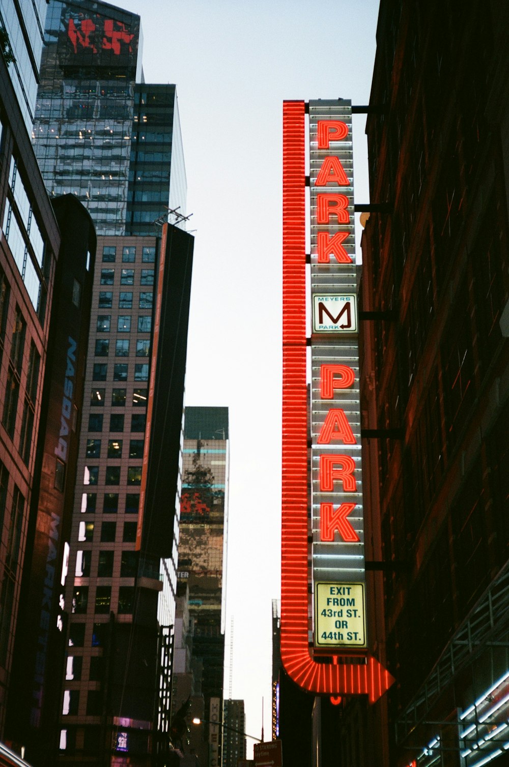 a city street filled with tall buildings next to tall buildings