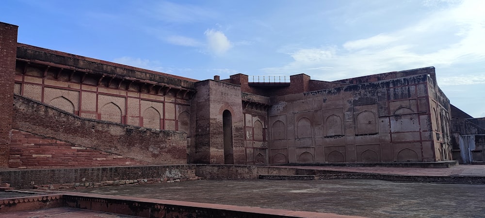 an old building with a staircase leading up to it