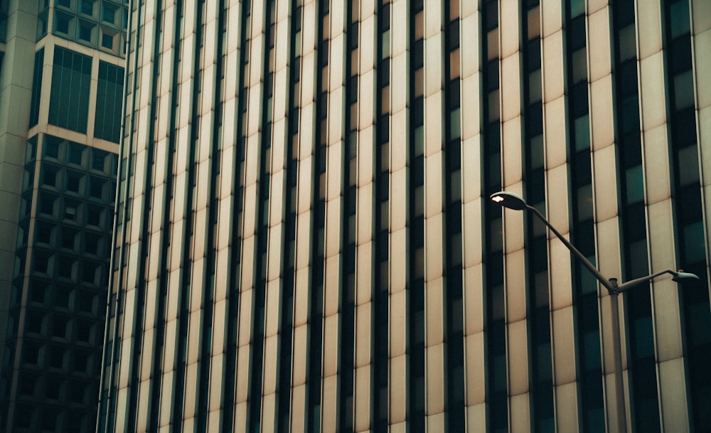 a street light in front of a tall building