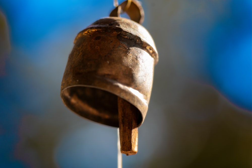 a close up of a bell on a string