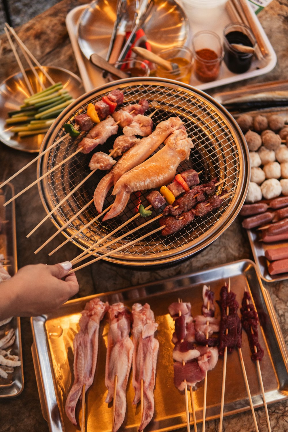 a table topped with lots of food on top of a grill