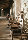 Group of residents enjoying a sunny afternoon on the porch.